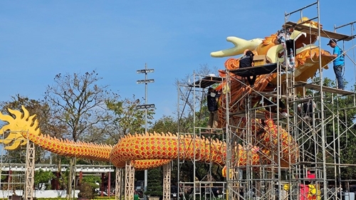 A pair of giant dragon mascots is set up to welcome Year of the Dragon