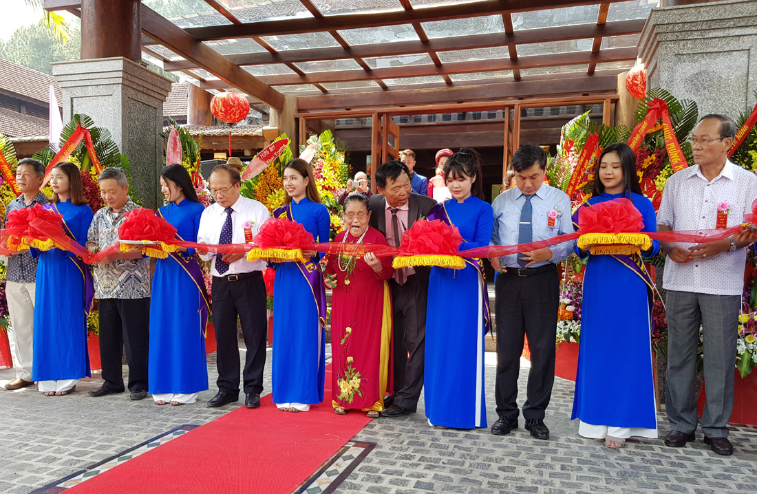 Delegates cut the ribbon to open the Sankofa Village Hill Resort & Spa at the ceremony
