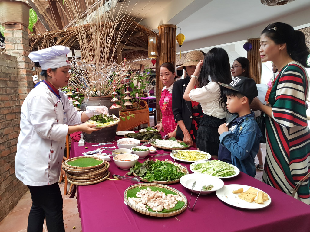 Visitors enjoy cuisine of many regions at the opening ceremony.