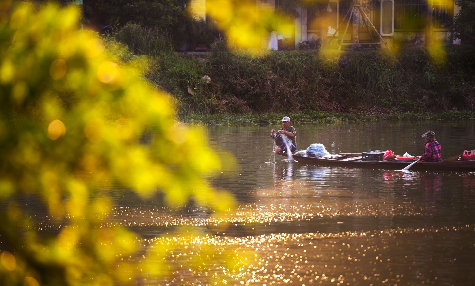 A fisherman couple in the autumn sun