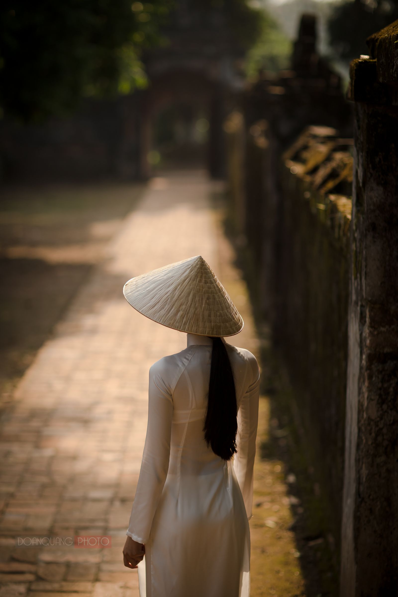 The figure of a girl in ao dai