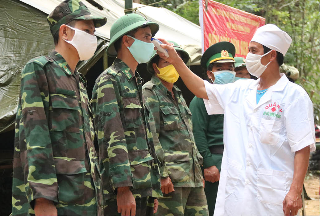 Every morning, army medical corps measure the body temperature of the soldiers