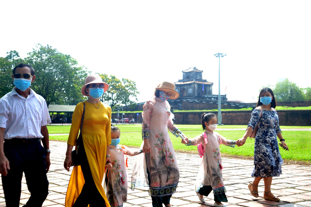 After the days at home, many tourists choose to wear ao dai during this holiday