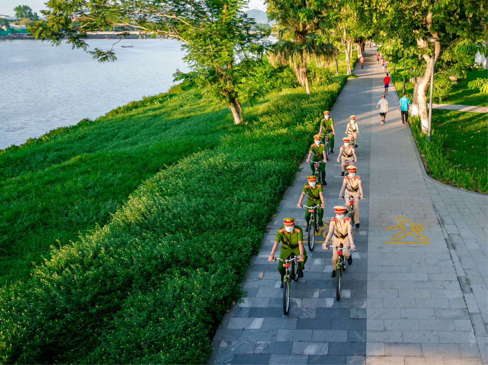 Patrolling on the walking paths along the Huong River banks and other streets 