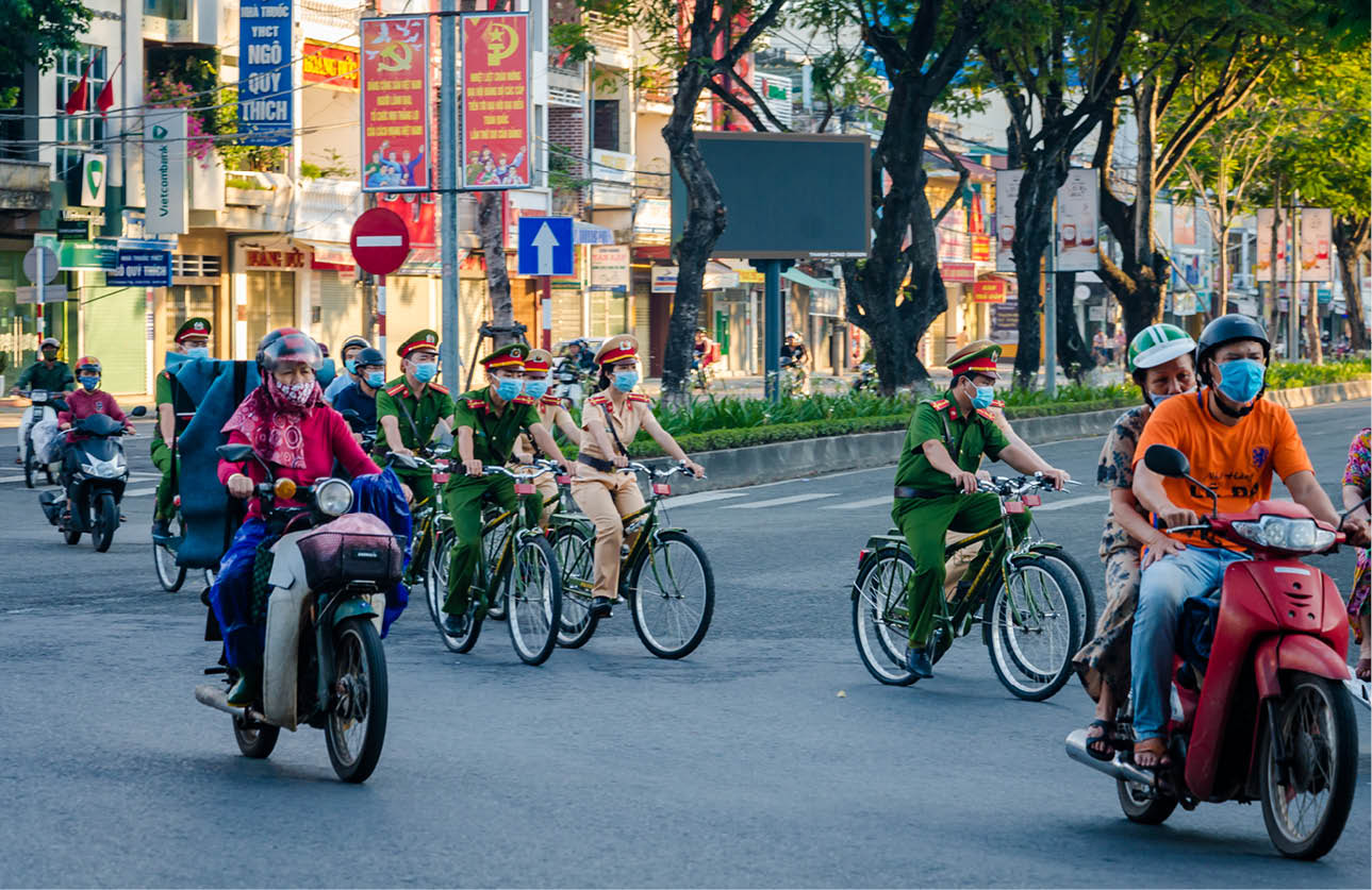 Patrolling on the walking paths along the Huong River banks and other streets 