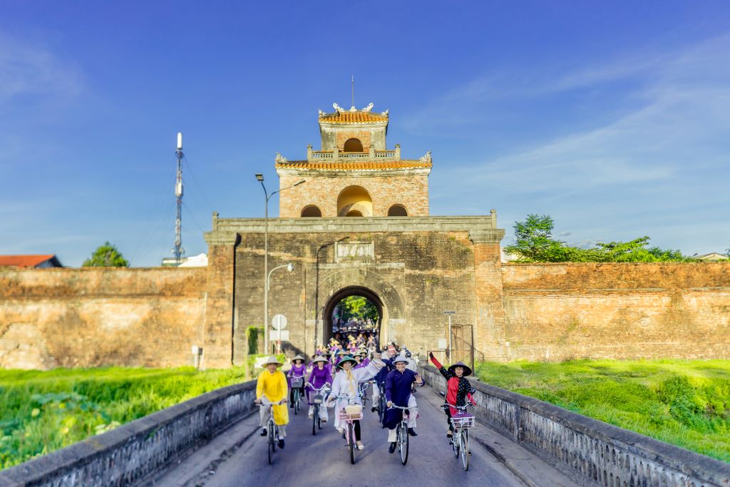 The delegation riding bicycles passing many streets and heritage sites of Hue