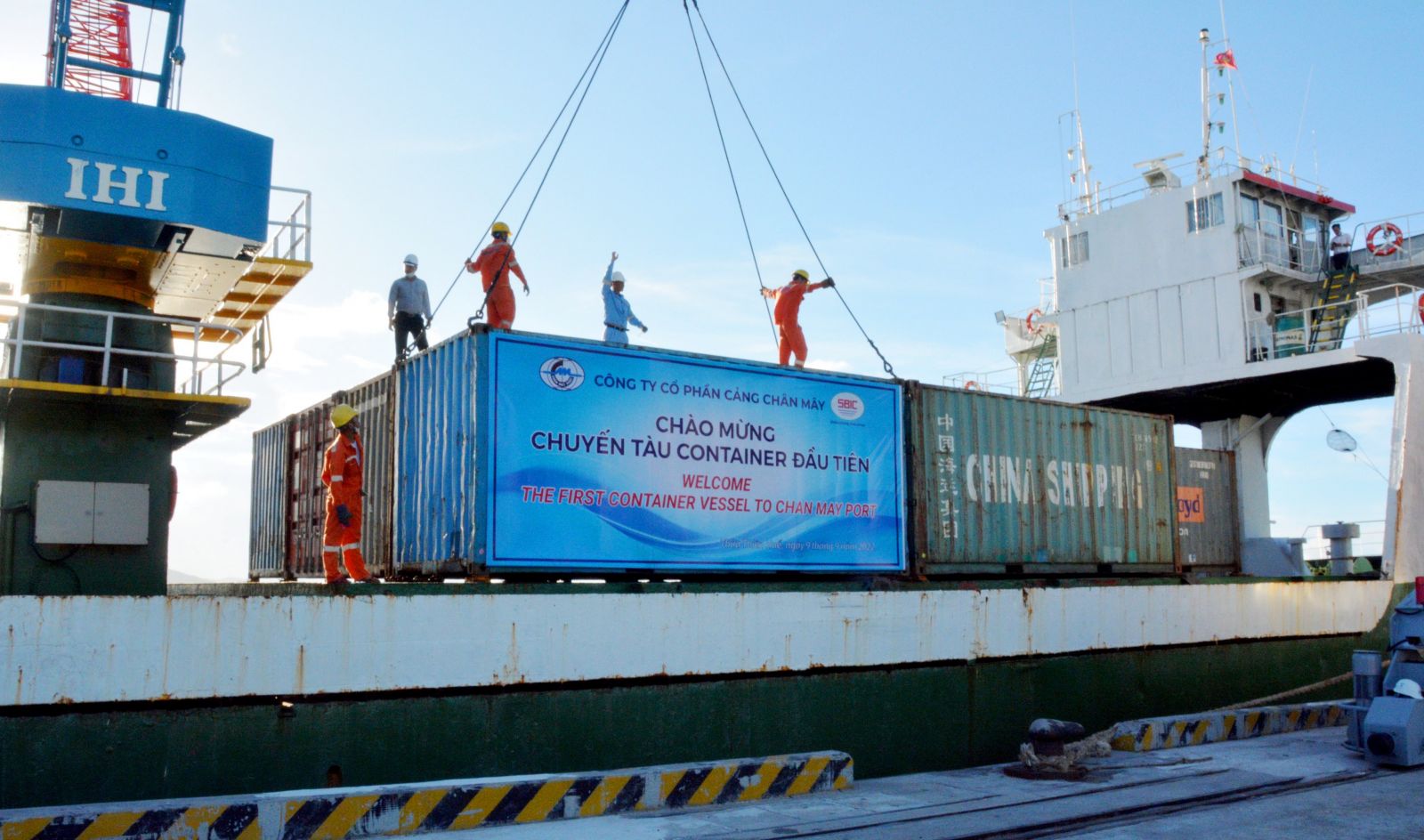 The first container being unloaded at the port