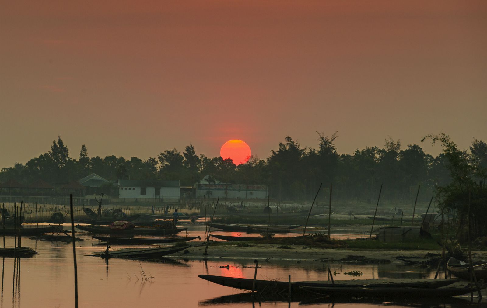 The sun rises over the lagoon