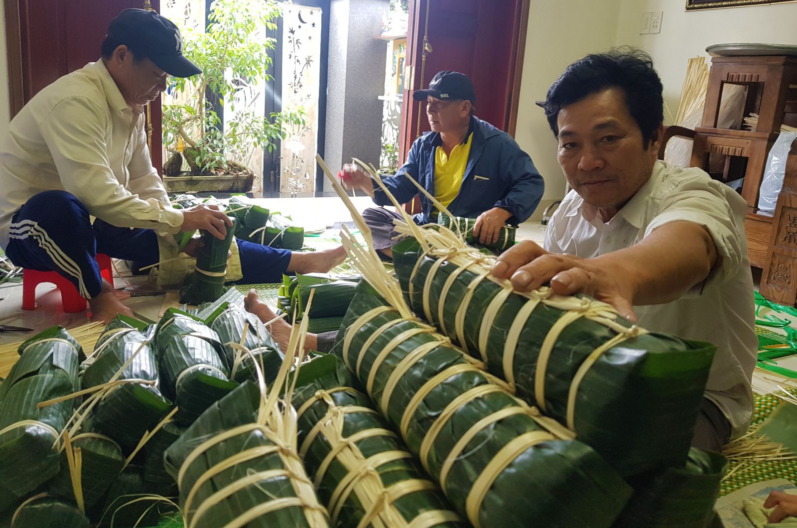 Banh Tet made by people is Chuon village are wrapped according to the request of customers from far away