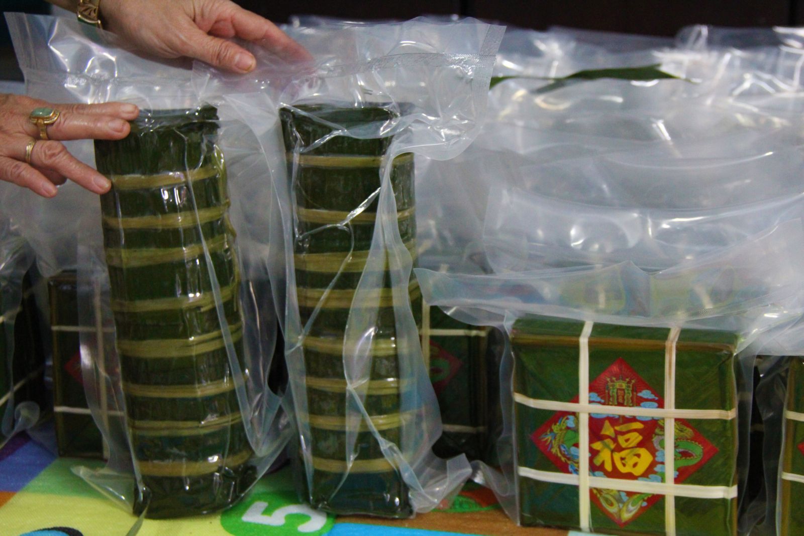The final products of banh Tet and banh Chung are packed and delivered to Ho Chi Minh City to ship to the customers