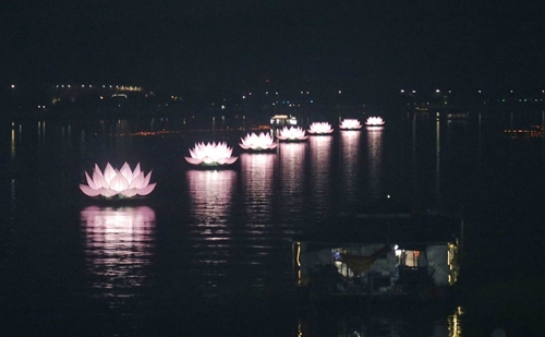 Seven lotus lanterns on the Huong River lit up to celebrate Buddha s birthday